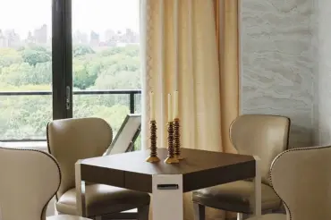 Elegant corner dining table featuring our custom Barclay Armless Dining Chairs.